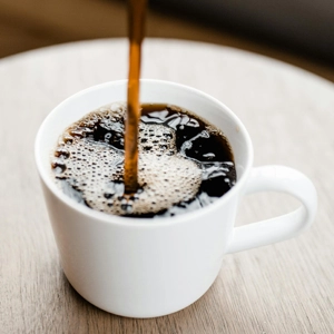 coffee pouring into white mug